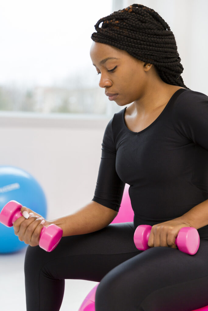 side-view-woman-exercising-with-weights