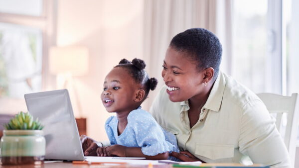 Nigerian parents planning and saving for their child’s education and long-term financial future.