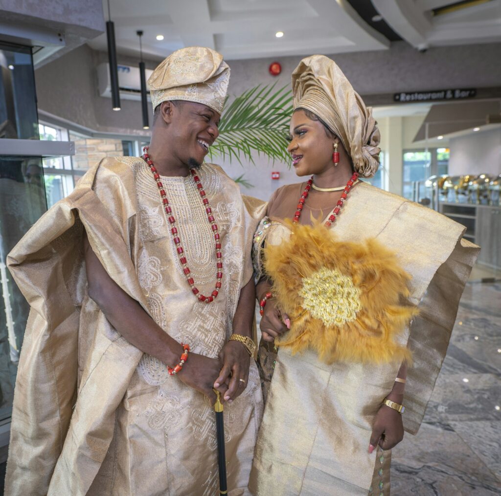A man and a woman in matching traditional clothing